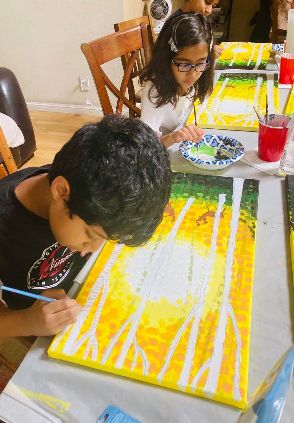 Student artwork and creative process at Imagination Arts.
