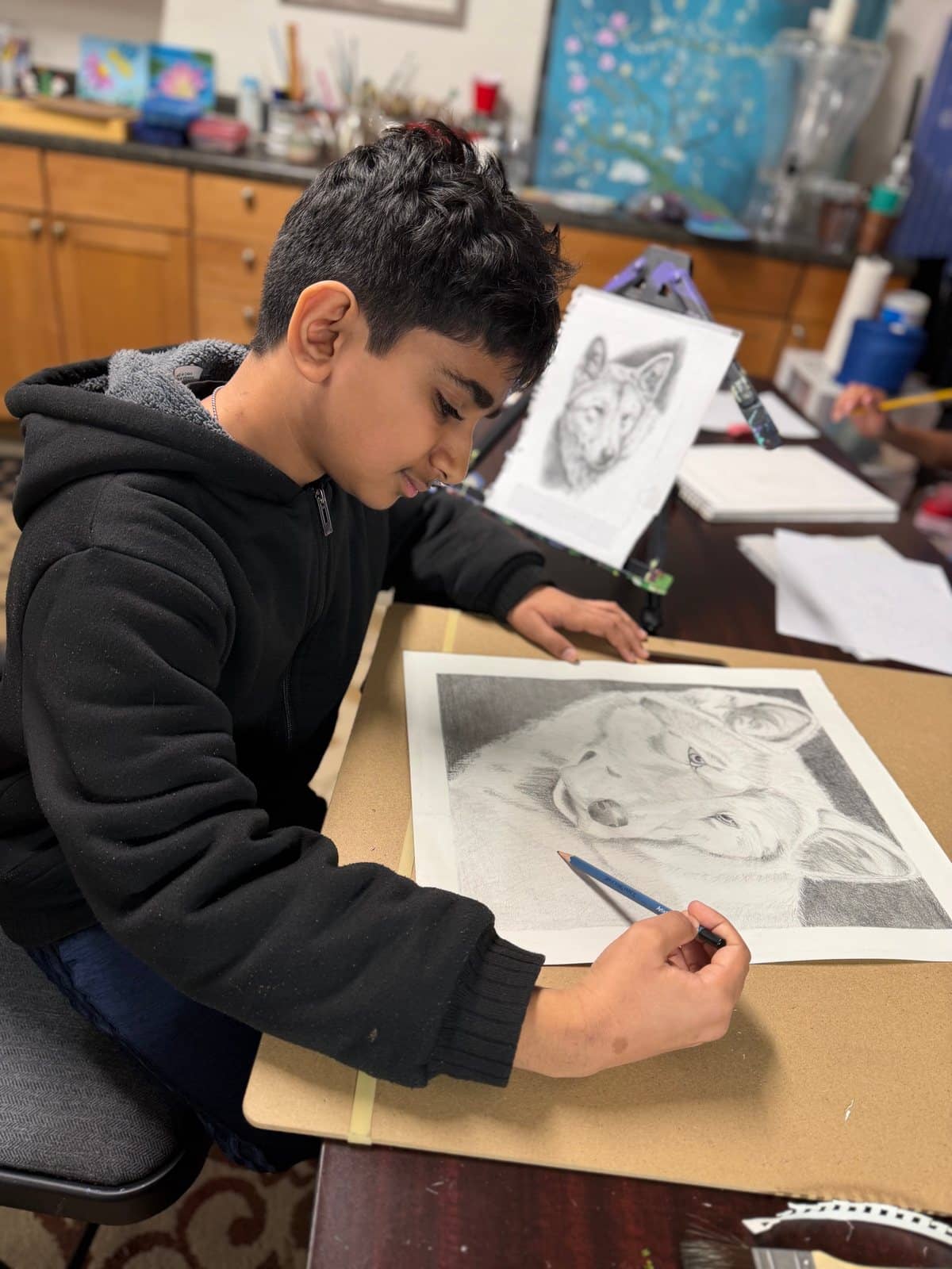 Student artwork and creative process at Imagination Arts.