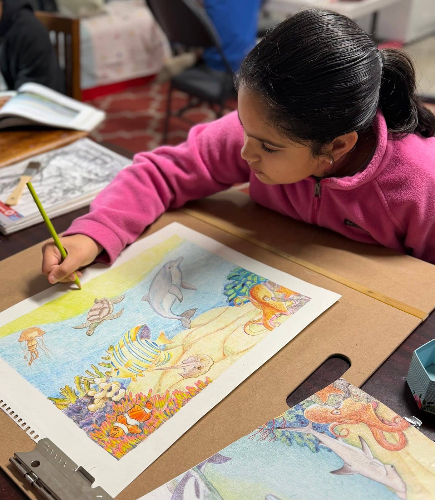 Student artwork and creative process at Imagination Arts.