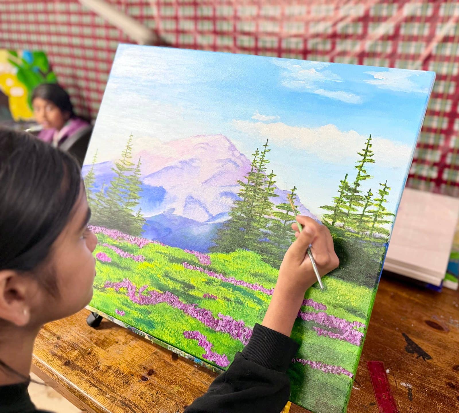 Student artwork and creative process at Imagination Arts.
